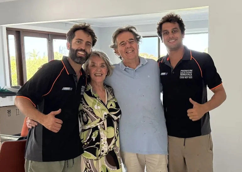 Premium Removals team with happy Gold Coast client in their new home